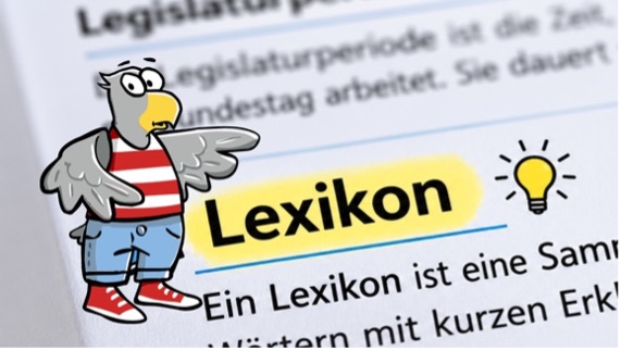 Karlchen Adler vor einem Lexikon-Eintrag